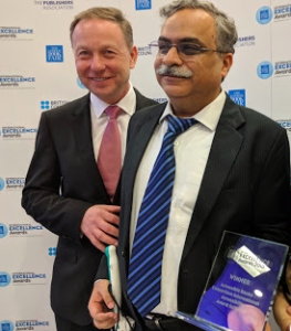 Dipendra manocha receiving the ABC International Excellence Award