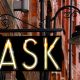Street sign with the word "ASK" lit up under a lamp