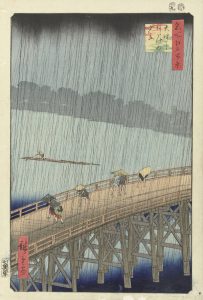 A woodcut print by Utagawa Hiroshige depicts figures scattering during a sudden rainstorm on the Shin-Ōhashi bridge in Edo (now Tokyo) in 1857.