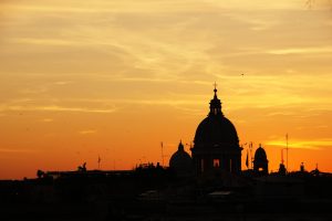 Glorious sunset in Rome with the silhouette of St Peter's Basilica dominating the skyline