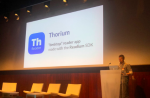 Daniel Weck presenting at DPUB with a power point slide containing the Thorium logo