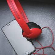 Space Gray Iphone 6 and Red On-ear Headphones
