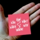 photograph of an open hand with a post note on the palm reading "how, who, what, when, why and where?"