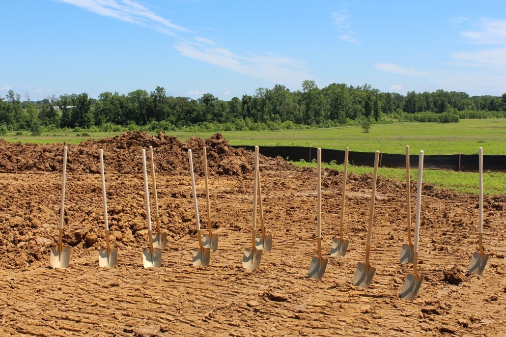 A ploughed field with rows of shovels about to break ground