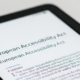 Portion of an ereading device screen with the EU flag and the title European Accessibility Act displayed