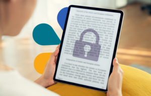 A tablet with blurred content and a superimposed image of a padlock on top indicating lack of access